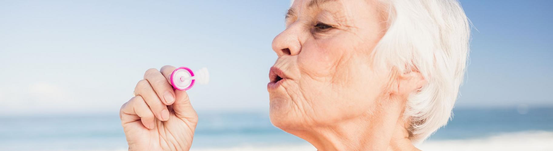 woman blowing bubbles